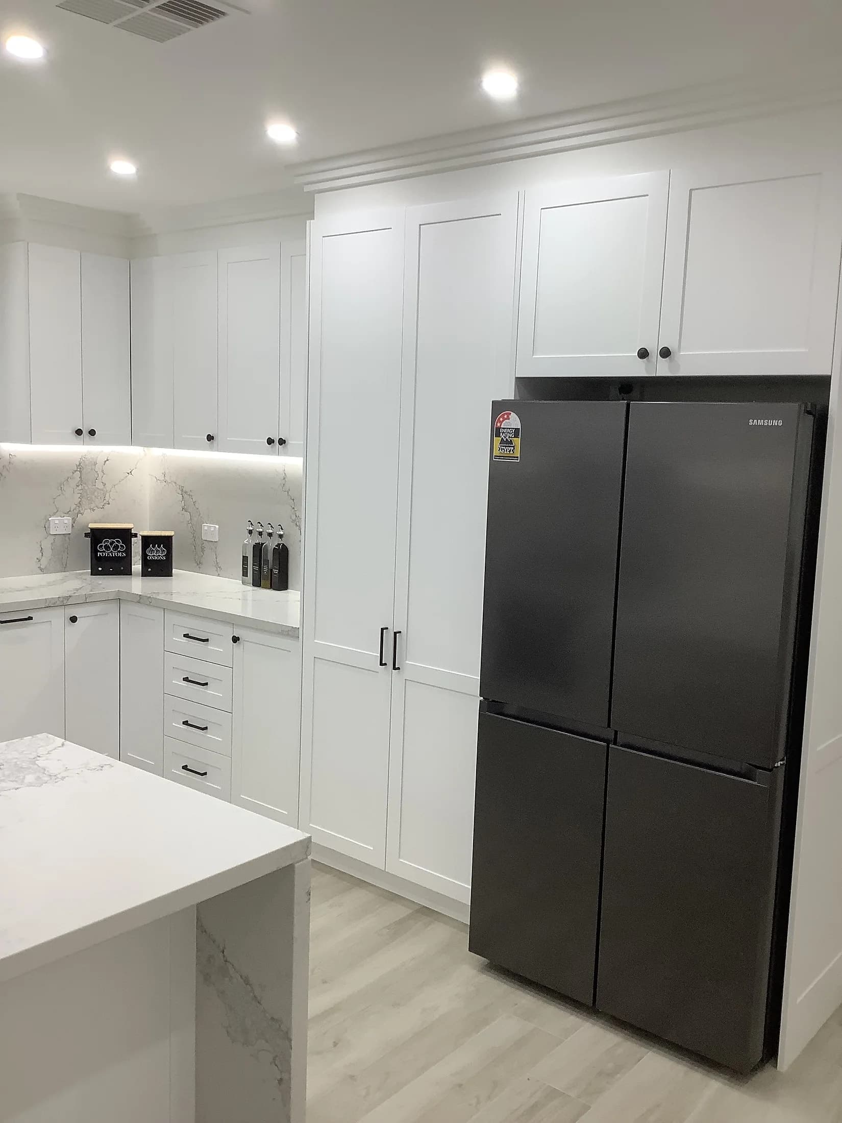 Custom kitchen cabinetry and surfaces by H&R Kitchens