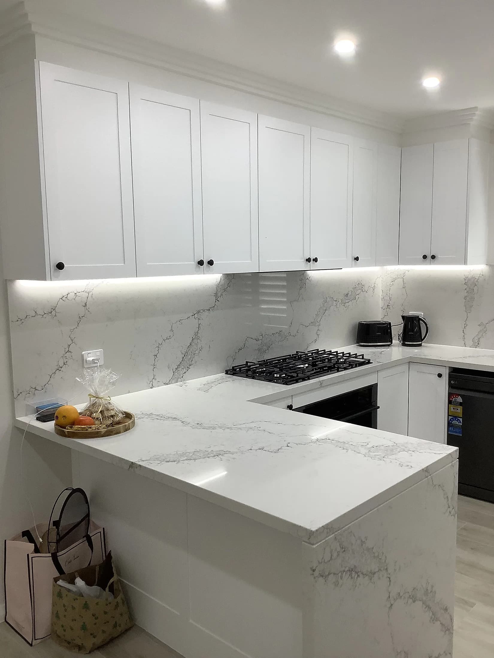 Custom kitchen cabinetry and surfaces by H&R Kitchens