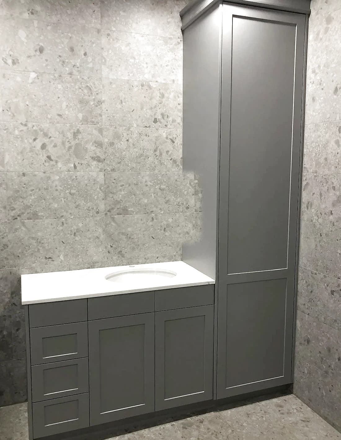 Custom bathroom vanity with grey shaker cabinetry, a stone benchtop, an undermount basin, a stone splashback and a mirrored cabinet, by H&R Kitchens