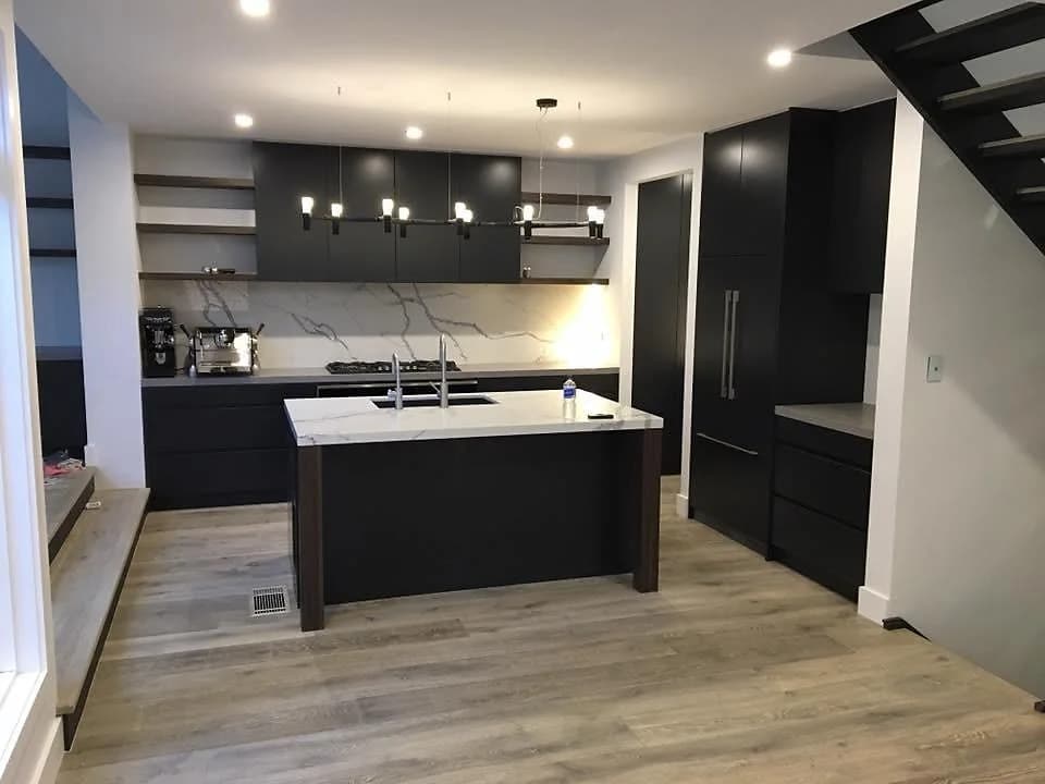 Completed black and white contemporary kitchen with an island in Parramatta